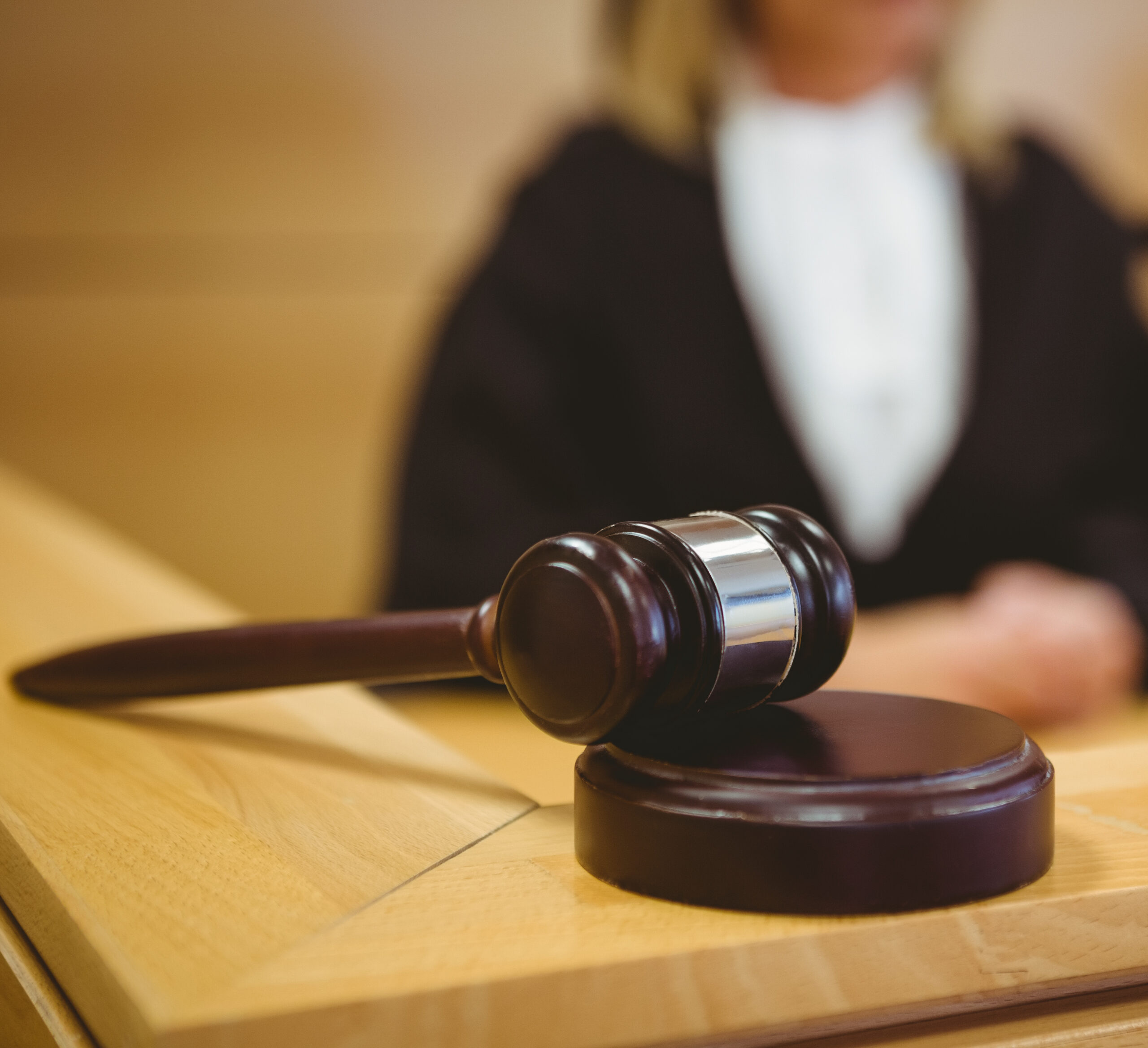 Gavel resting on sounding block in the court room