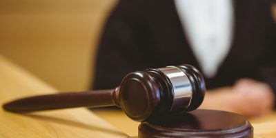 Gavel resting on sounding block in the court room